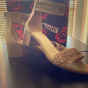 Women’s Fergilicious block heel, ankle strap sandals.